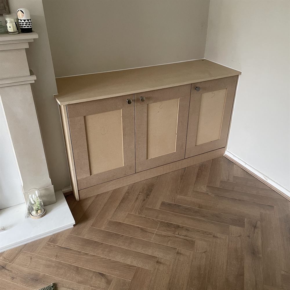 Herringbone floor and fitted cabinetry